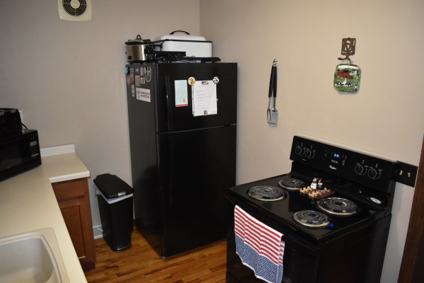 Kitchen refrigerator and stove at FishInn